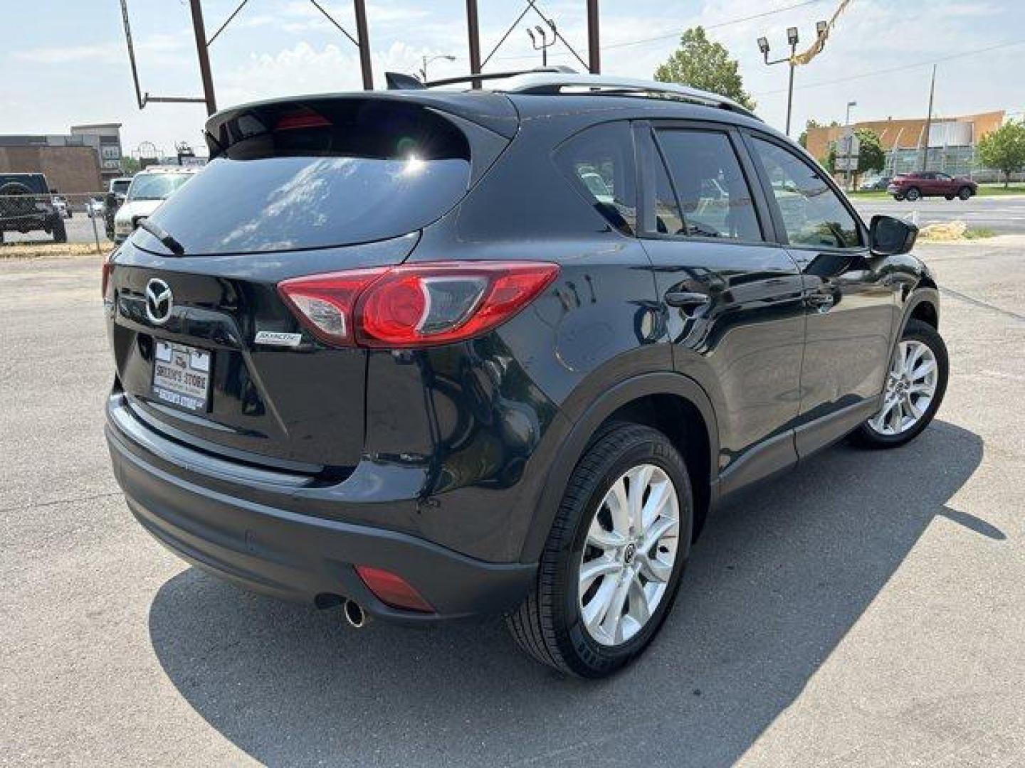 2014 Jet Black Mica /Black Mazda CX-5 (JM3KE4DY7E0) with an 4 2.5 L engine, Automatic transmission, located at 3240 Washington Blvd., Ogden, 84401, (801) 621-7177, 41.204967, -111.969994 - *2014 Mazda CX-5 AWD Grand Touring*Sherm's Store is a family owned and operated independent auto dealer that has become a household name serving Utah for over 50 years! We specialize in excellent condition, pre-owned vehicles. Here at Sherm's, we never mark up interest rates! This means that what yo - Photo#4