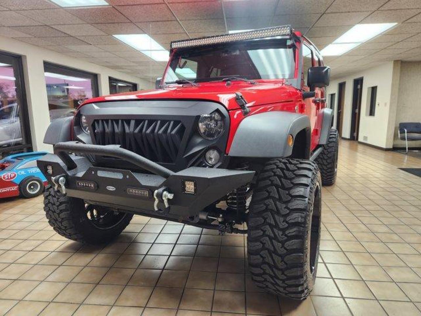 2017 Firecracker Red Clearcoat /Black Jeep Wrangler Unlimited (1C4BJWDG6HL) with an 6 3.6 L engine, Automatic transmission, located at 3240 Washington Blvd., Ogden, 84401, (801) 621-7177, 41.204967, -111.969994 - *2017 Jeep Wrangler Unlimited Sport 4x4*Sherm's Store is a family owned and operated independent auto dealer that has become a household name serving Utah for over 50 years! We specialize in excellent condition, pre-owned vehicles. Here at Sherm's, we never mark up interest rates! This means that wh - Photo#0