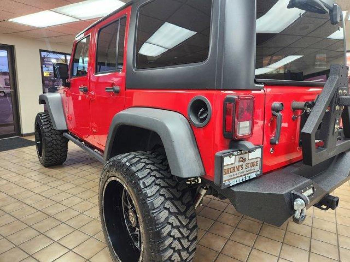 2017 Firecracker Red Clearcoat /Black Jeep Wrangler Unlimited (1C4BJWDG6HL) with an 6 3.6 L engine, Automatic transmission, located at 3240 Washington Blvd., Ogden, 84401, (801) 621-7177, 41.204967, -111.969994 - *2017 Jeep Wrangler Unlimited Sport 4x4*Sherm's Store is a family owned and operated independent auto dealer that has become a household name serving Utah for over 50 years! We specialize in excellent condition, pre-owned vehicles. Here at Sherm's, we never mark up interest rates! This means that wh - Photo#2