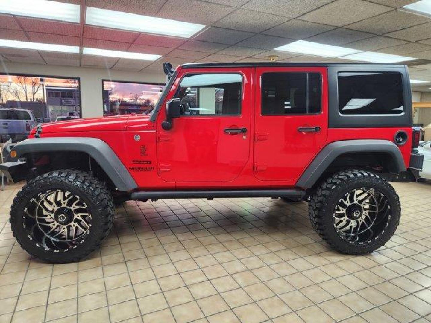 2017 Firecracker Red Clearcoat /Black Jeep Wrangler Unlimited (1C4BJWDG6HL) with an 6 3.6 L engine, Automatic transmission, located at 3240 Washington Blvd., Ogden, 84401, (801) 621-7177, 41.204967, -111.969994 - *2017 Jeep Wrangler Unlimited Sport 4x4*Sherm's Store is a family owned and operated independent auto dealer that has become a household name serving Utah for over 50 years! We specialize in excellent condition, pre-owned vehicles. Here at Sherm's, we never mark up interest rates! This means that wh - Photo#3