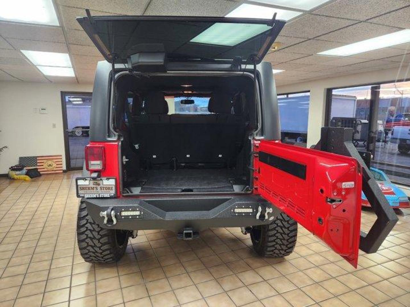 2017 Firecracker Red Clearcoat /Black Jeep Wrangler Unlimited (1C4BJWDG6HL) with an 6 3.6 L engine, Automatic transmission, located at 3240 Washington Blvd., Ogden, 84401, (801) 621-7177, 41.204967, -111.969994 - *2017 Jeep Wrangler Unlimited Sport 4x4*Sherm's Store is a family owned and operated independent auto dealer that has become a household name serving Utah for over 50 years! We specialize in excellent condition, pre-owned vehicles. Here at Sherm's, we never mark up interest rates! This means that wh - Photo#4