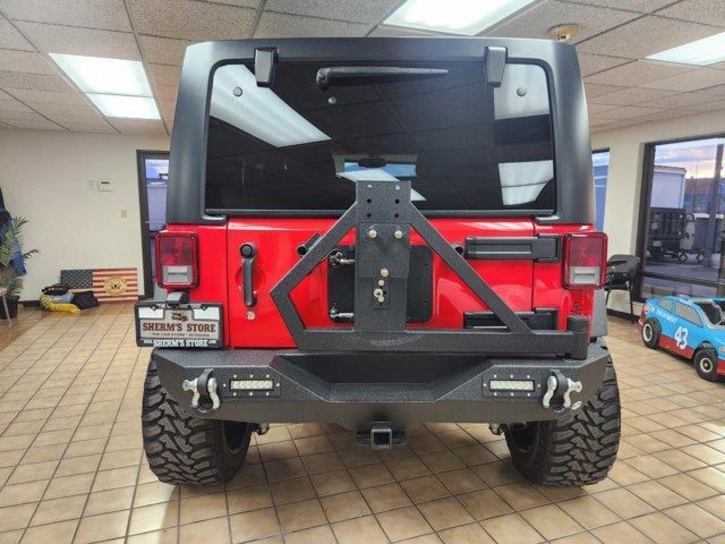 2017 Firecracker Red Clearcoat /Black Jeep Wrangler Unlimited (1C4BJWDG6HL) with an 6 3.6 L engine, Automatic transmission, located at 3240 Washington Blvd., Ogden, 84401, (801) 621-7177, 41.204967, -111.969994 - *2017 Jeep Wrangler Unlimited Sport 4x4*Sherm's Store is a family owned and operated independent auto dealer that has become a household name serving Utah for over 50 years! We specialize in excellent condition, pre-owned vehicles. Here at Sherm's, we never mark up interest rates! This means that wh - Photo#5