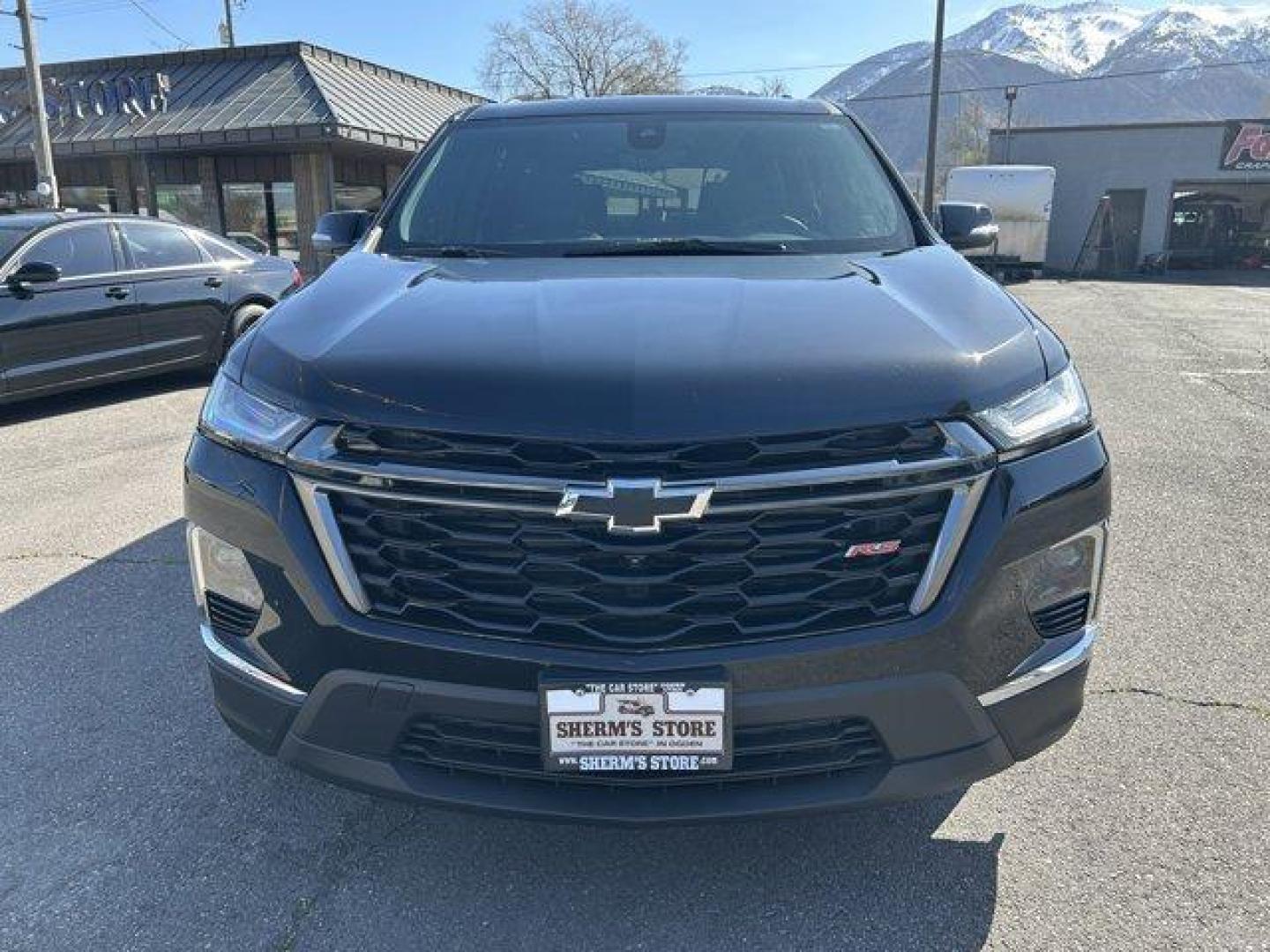 2023 Mosaic Black Metallic /Jet Black/Spice Red Chevrolet Traverse (1GNEVJKW0PJ) with an 6 3.6L engine, Automatic transmission, located at 3240 Washington Blvd., Ogden, 84401, (801) 621-7177, 41.204967, -111.969994 - *2023 Chevrolet Traverse AWD 4dr RS*Loaded, low miles, one owner and super clean. All service done at Chevy dealer.Dual sunroof, leather, heated front seats, heated steering wheel, heated power folding side mirrors, all-weather floor mats, power lift gate with programmable height, Bose sound system - Photo#1