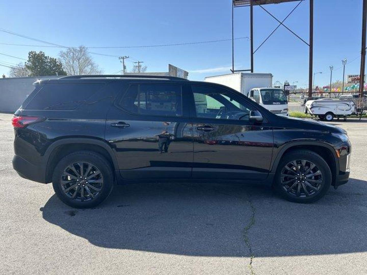 2023 Mosaic Black Metallic /Jet Black/Spice Red Chevrolet Traverse (1GNEVJKW0PJ) with an 6 3.6L engine, Automatic transmission, located at 3240 Washington Blvd., Ogden, 84401, (801) 621-7177, 41.204967, -111.969994 - *2023 Chevrolet Traverse AWD 4dr RS*Loaded, low miles, one owner and super clean. All service done at Chevy dealer.Dual sunroof, leather, heated front seats, heated steering wheel, heated power folding side mirrors, all-weather floor mats, power lift gate with programmable height, Bose sound system - Photo#3