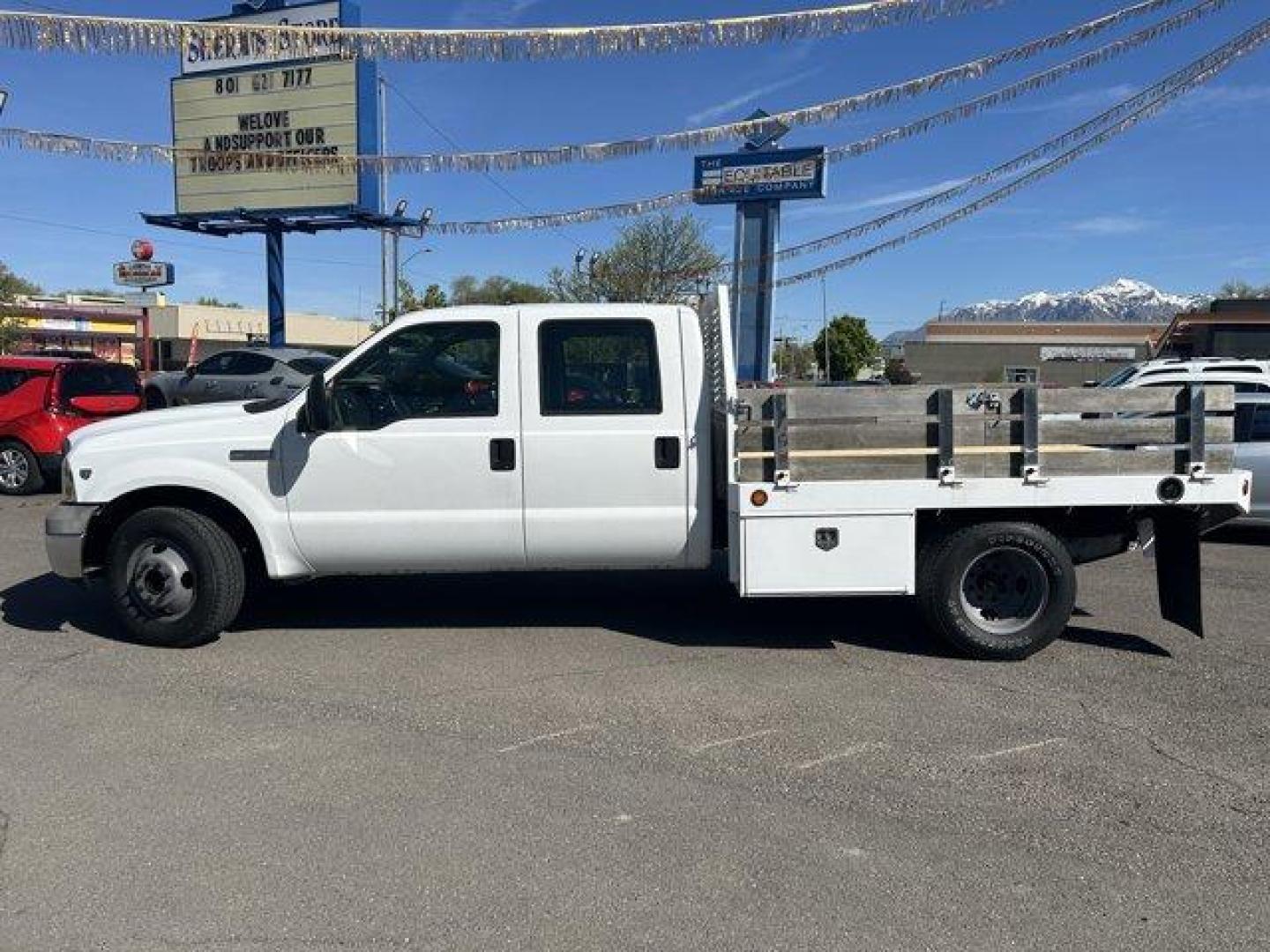 2005 Ford Super Duty F-350 DRW (1FDWW36Y85E) with an 10 6.8L engine, located at 3240 Washington Blvd., Ogden, 84401, (801) 621-7177, 41.204967, -111.969994 - *2005 Ford Super Duty F-350 DRW Crew Cab 176 WB 60 CA XL*6.8-liter v10 gas engine. Drop side flatbed with dual-locking toolboxes, gooseneck ball under steel plate in bed, and 2-inch receiver. Brand-new wood deck with 8 tie down hooks.Sherm's Store is a family owned and operated independent auto deal - Photo#7