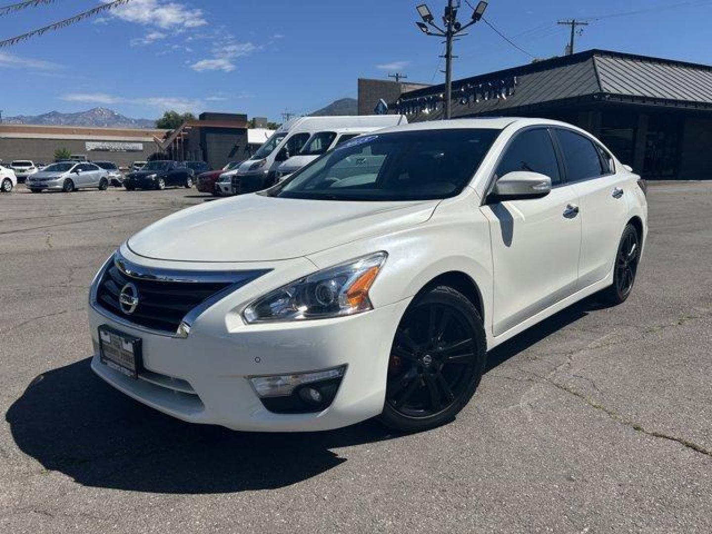 2015 Pearl White /Charcoal Nissan Altima (1N4BL3AP1FC) with an 6 3.5 L engine, Variable transmission, located at 3240 Washington Blvd., Ogden, 84401, (801) 621-7177, 41.204967, -111.969994 - *2015 Nissan Altima 4dr Sdn V6 3.5*Sherm's Store is a family owned and operated independent auto dealer that has become a household name serving Utah for over 50 years! We specialize in excellent condition, pre-owned vehicles. Here at Sherm's, we never mark up interest rates! This means that what yo - Photo#0