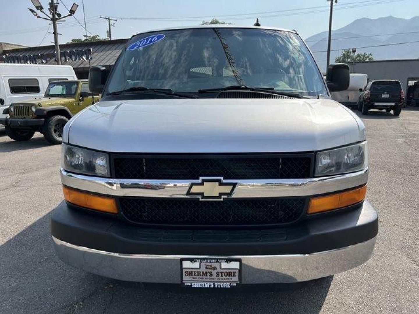 2016 Silver Ice Metallic /Medium Pewter Chevrolet Express Passenger (1GAZGMFG7G1) with an 8 6.0L engine, Automatic transmission, located at 3240 Washington Blvd., Ogden, 84401, (801) 621-7177, 41.204967, -111.969994 - *2016 Chevrolet Express Passenger RWD 3500 135 LT w/1LT*Sherm's Store is a family owned and operated independent auto dealer that has become a household name serving Utah for over 50 years! We specialize in excellent condition, pre-owned vehicles. Here at Sherm's, we never mark up interest rates! Th - Photo#1