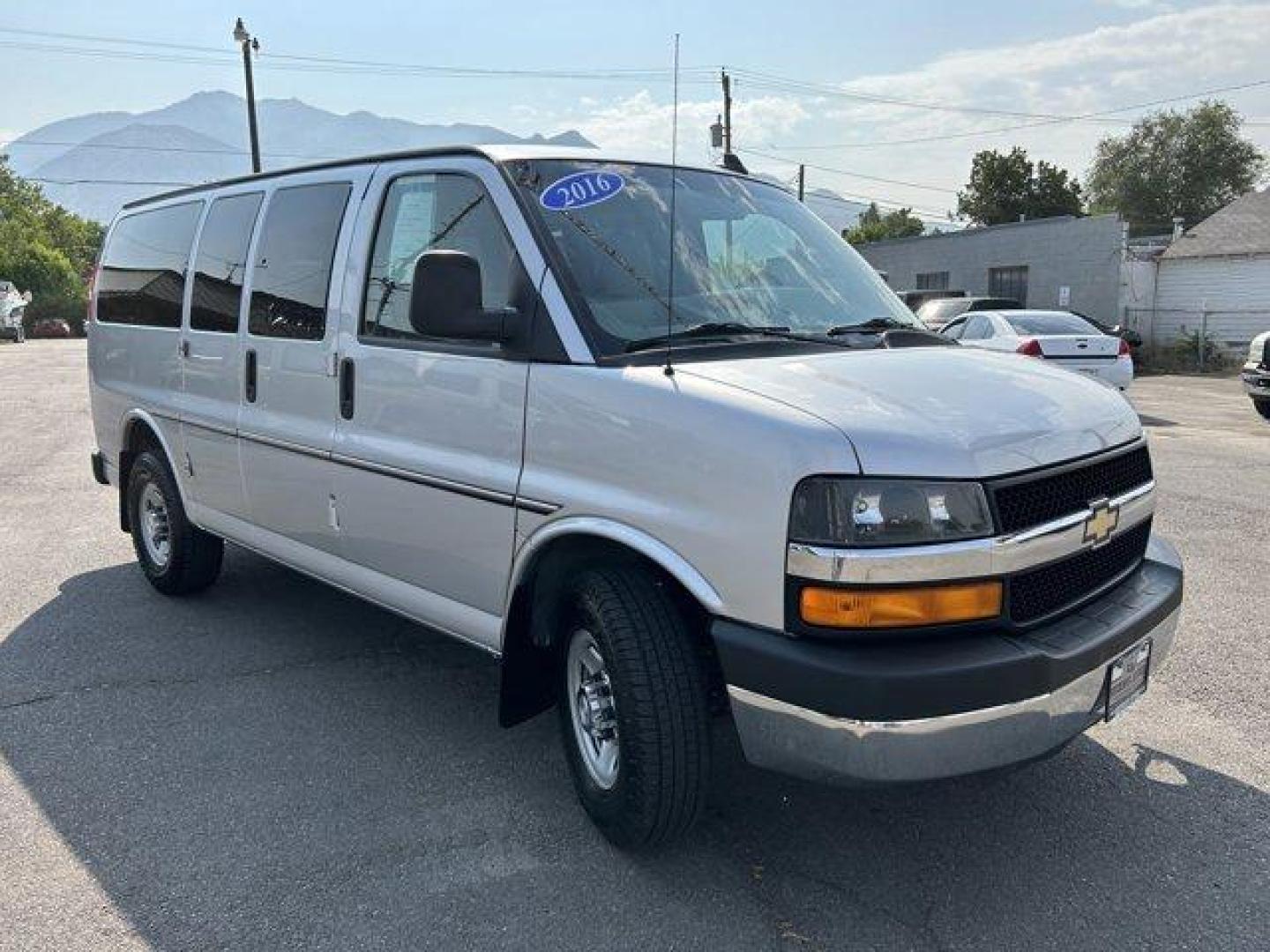 2016 Silver Ice Metallic /Medium Pewter Chevrolet Express Passenger (1GAZGMFG7G1) with an 8 6.0L engine, Automatic transmission, located at 3240 Washington Blvd., Ogden, 84401, (801) 621-7177, 41.204967, -111.969994 - *2016 Chevrolet Express Passenger RWD 3500 135 LT w/1LT*Sherm's Store is a family owned and operated independent auto dealer that has become a household name serving Utah for over 50 years! We specialize in excellent condition, pre-owned vehicles. Here at Sherm's, we never mark up interest rates! Th - Photo#2