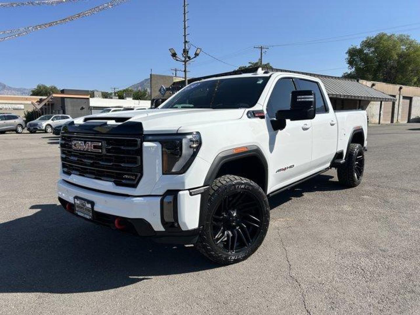 2024 Summit White /Jet Black with Kalahari accents GMC Sierra 3500HD (1GT49VEY8RF) with an 8 6.6L engine, Automatic transmission, located at 3240 Washington Blvd., Ogden, 84401, (801) 621-7177, 41.204967, -111.969994 - *2024 GMC Sierra 3500HD AT4*Loaded! Two-tone leather (heated and cooled) power seats, sunroof, power running boards, remote start, multi-function tailgate, 360 backup camera, Rev Industries hard folding bed cover, heads-up display, wireless phone charger, 22 Fuel wheels with Toyo Open Country A/T II - Photo#0