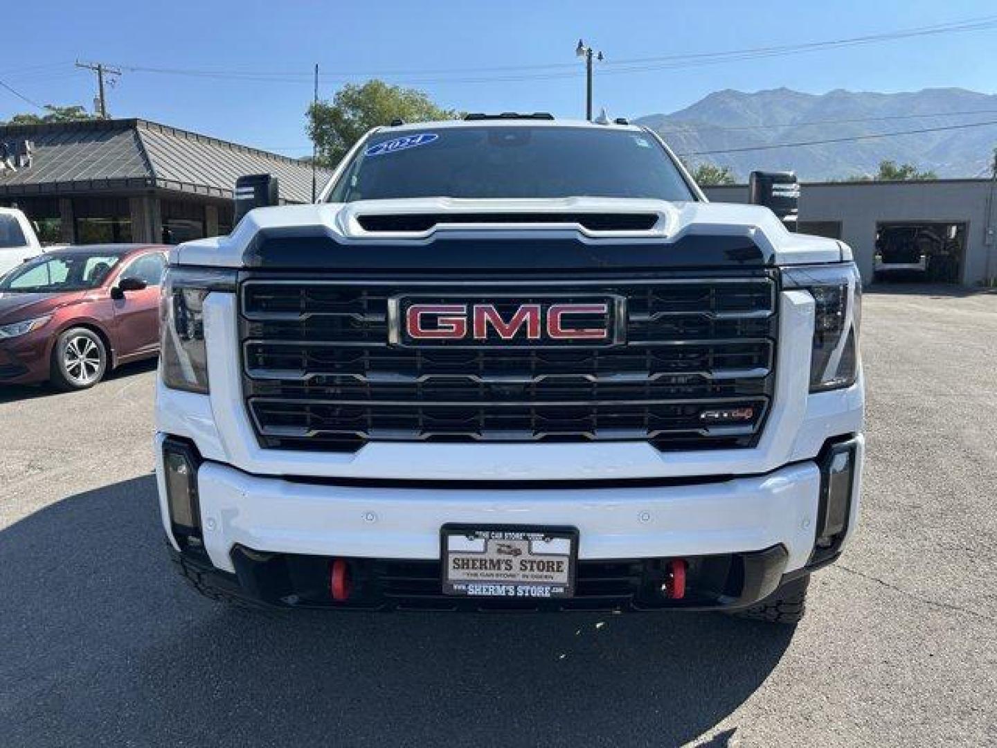 2024 Summit White /Jet Black with Kalahari accents GMC Sierra 3500HD (1GT49VEY8RF) with an 8 6.6L engine, Automatic transmission, located at 3240 Washington Blvd., Ogden, 84401, (801) 621-7177, 41.204967, -111.969994 - *2024 GMC Sierra 3500HD AT4*Loaded! Two-tone leather (heated and cooled) power seats, sunroof, power running boards, remote start, multi-function tailgate, 360 backup camera, Rev Industries hard folding bed cover, heads-up display, wireless phone charger, 22 Fuel wheels with Toyo Open Country A/T II - Photo#1