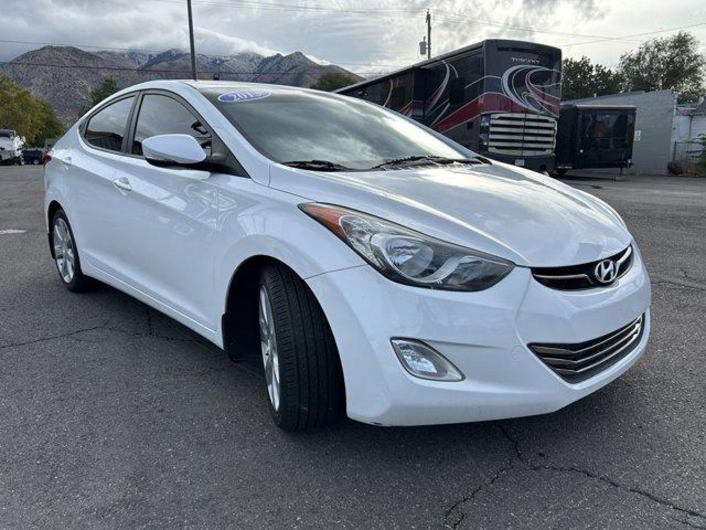 2013 Shimmering White /Beige Hyundai Elantra (5NPDH4AE9DH) with an 4 1.8L engine, Automatic transmission, located at 3240 Washington Blvd., Ogden, 84401, (801) 621-7177, 41.204967, -111.969994 - *2013 Hyundai Elantra Limited** *This sleek Elantra is ready for you! The 1.8L inline 4 engine gives you a nice smooth ride!This is a 2 owner no accidents vehicle and the condition is excellent!You'll feel great driving it with its leather interior, back up camera, power windows, locks and mirrors, - Photo#2