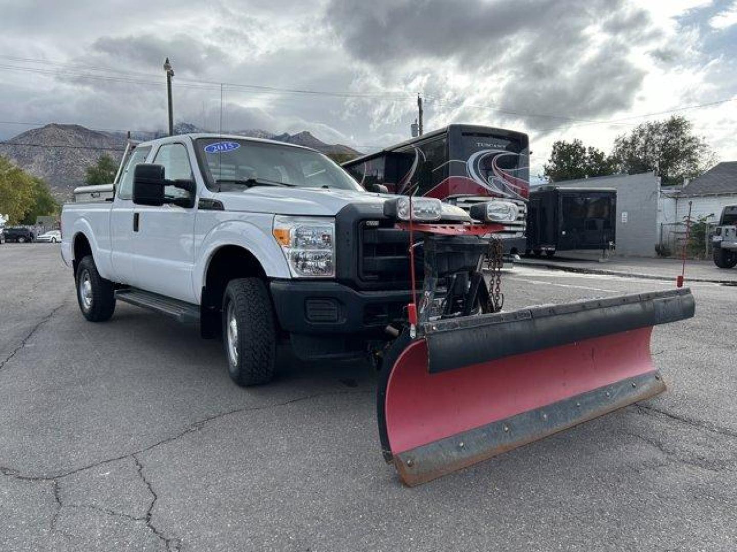 2015 White /gray Ford Super Duty F-250 SRW (1FT7X2B61FE) with an 8 6.2L engine, Automatic transmission, located at 3240 Washington Blvd., Ogden, 84401, (801) 621-7177, 41.204967, -111.969994 - *2015 Ford F-250 4WD Plow*This Super Duty is ready for this winter!! Its a 4 wheel drive extended cab! 1 owner, no accidents, complete with a *headache rack and 2 bed side-mount tool boxes!*You'll make plowing look easy with the *Western Ultra Mount 2 plow and BOSS TGS 800 salter combo!*Sherm's Stor - Photo#2