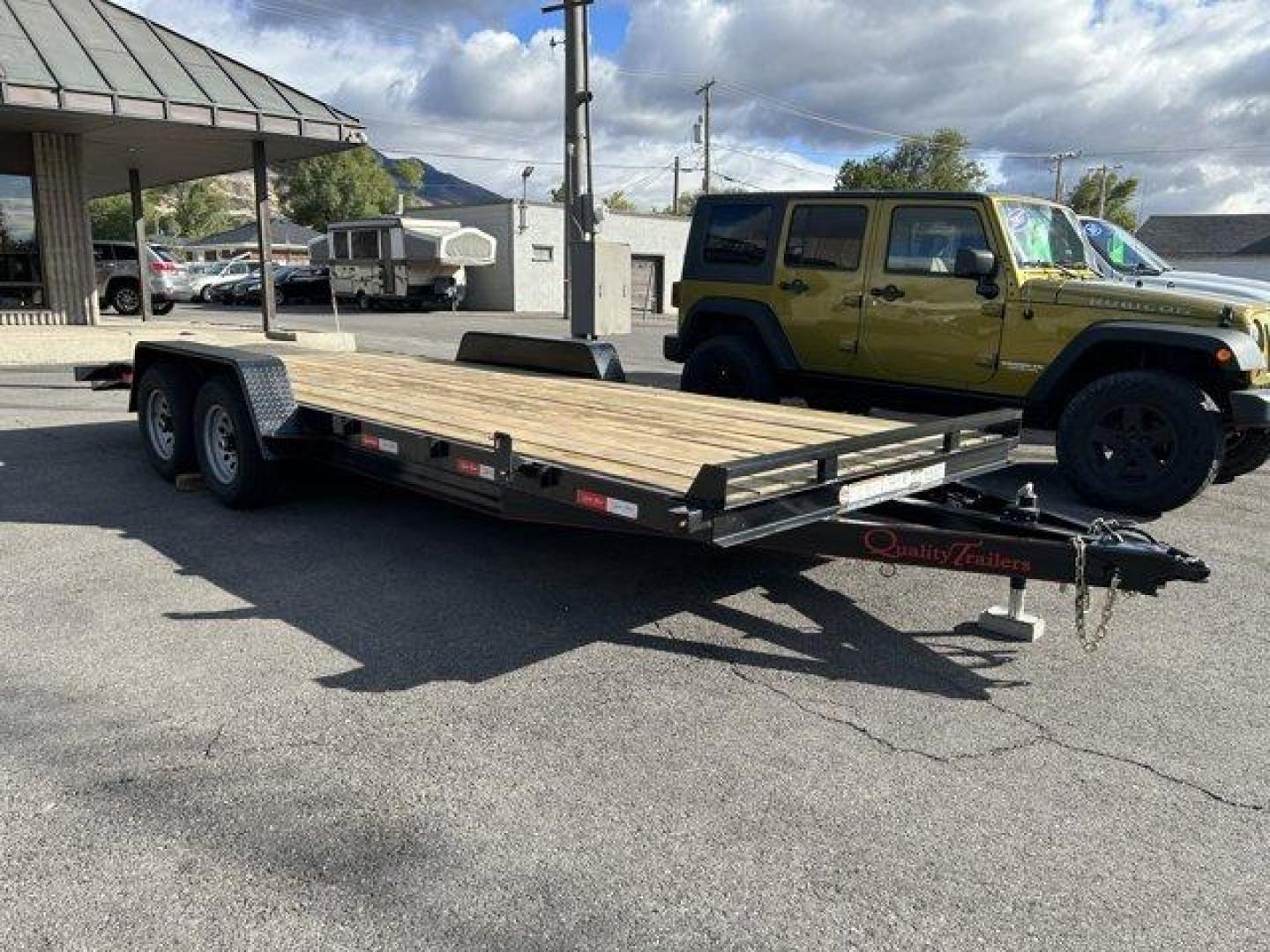 (7RA1A202755) , located at 3240 Washington Blvd., Ogden, 84401, (801) 621-7177, 41.204967, -111.969994 - ====== 2025 Quality Trailers 20ft Tandem Axel Car Hauler- 9990LB GVWR ======Don't miss this like new trailer (used for one trip) at a steal of a price! The deck measures 20 feet long (18' + 2' dovetail by 82 wide between the fenders) The 5' ladder ramps stow in channels under the back of the trailer - Photo#0