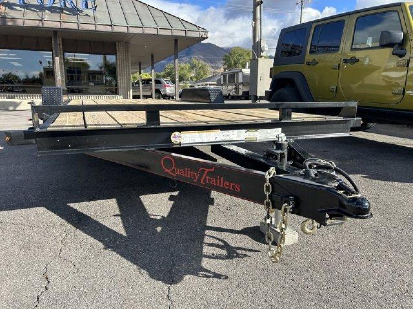 (7RA1A202755) , located at 3240 Washington Blvd., Ogden, 84401, (801) 621-7177, 41.204967, -111.969994 - ====== 2025 Quality Trailers 20ft Tandem Axel Car Hauler- 9990LB GVWR ======Don't miss this like new trailer (used for one trip) at a steal of a price! The deck measures 20 feet long (18' + 2' dovetail by 82 wide between the fenders) The 5' ladder ramps stow in channels under the back of the trailer - Photo#1