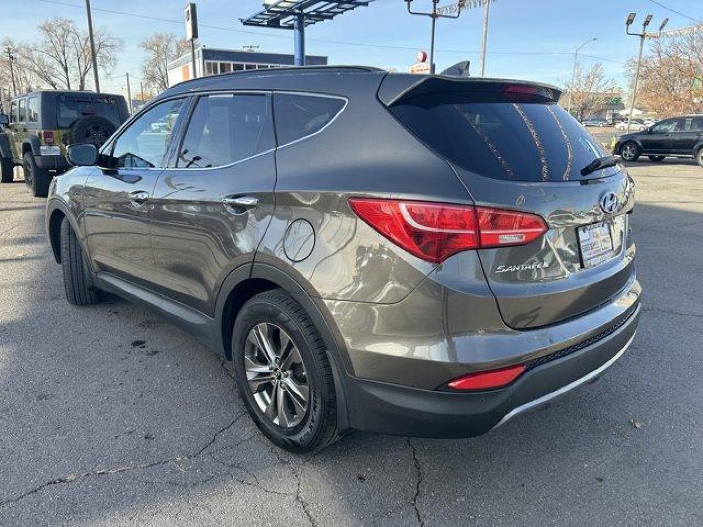 2014 Cabo Bronze /Beige Hyundai Santa Fe Sport (5XYZU3LB4EG) with an 4 2.4 L engine, Automatic transmission, located at 3240 Washington Blvd., Ogden, 84401, (801) 621-7177, 41.204967, -111.969994 - Get ready to experience the perfect blend of style, performance, and reliability with this 2014 Hyundai Santa Fe Sport FWD 4dr 2.4! With 135,913 miles on the odometer, this well-maintained midsize SUV still has plenty of adventure left to offer. Powered by a 2.4-liter 4-cylinder engine, it delivers - Photo#6